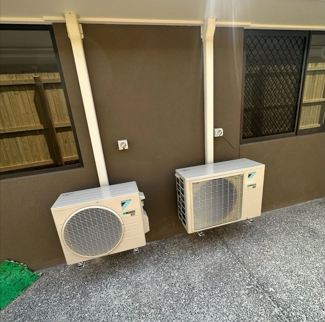 Two outdoor air-conditioning units installed side by side